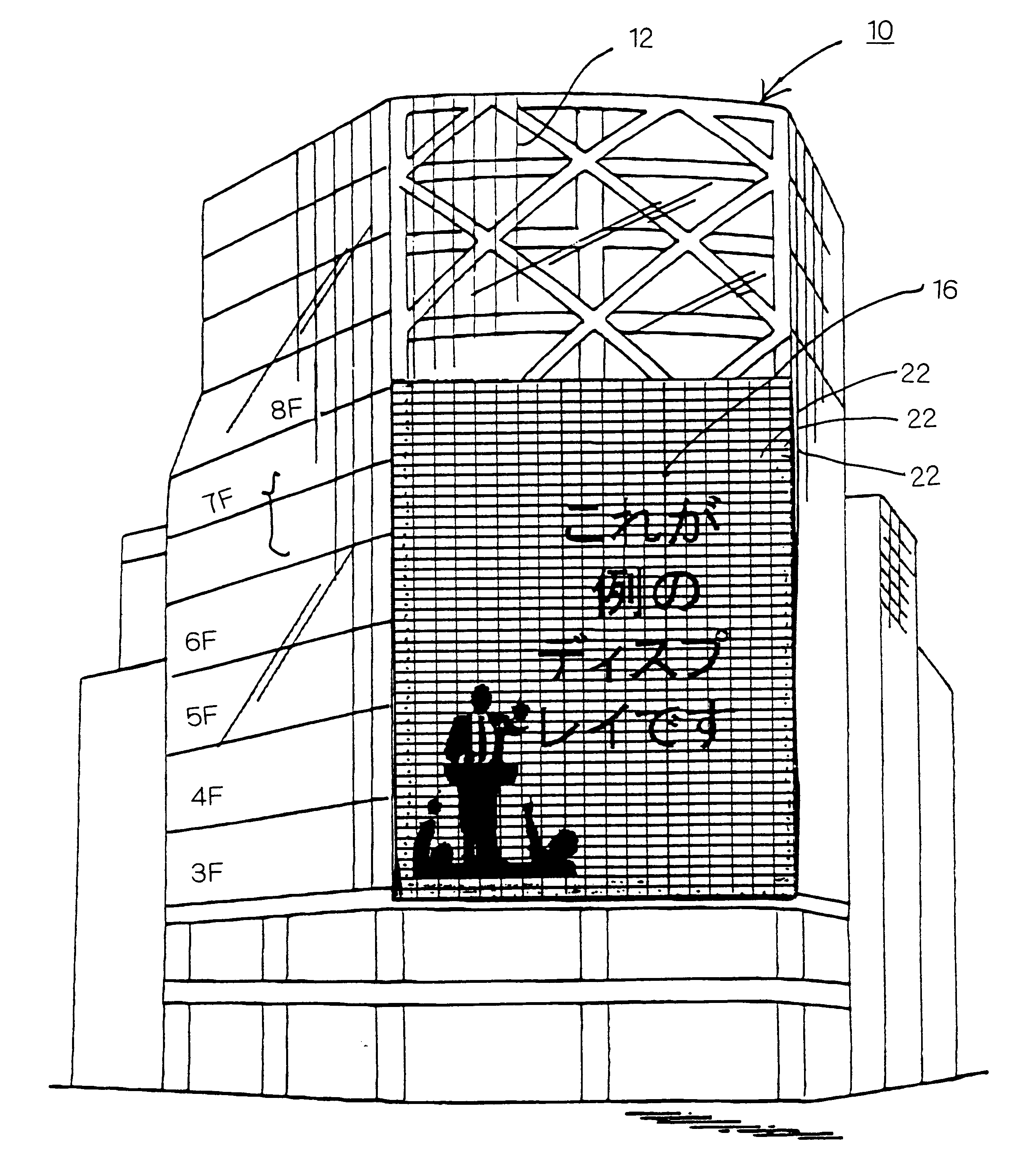 High-rise building with large scale display device inside transparent glass exterior