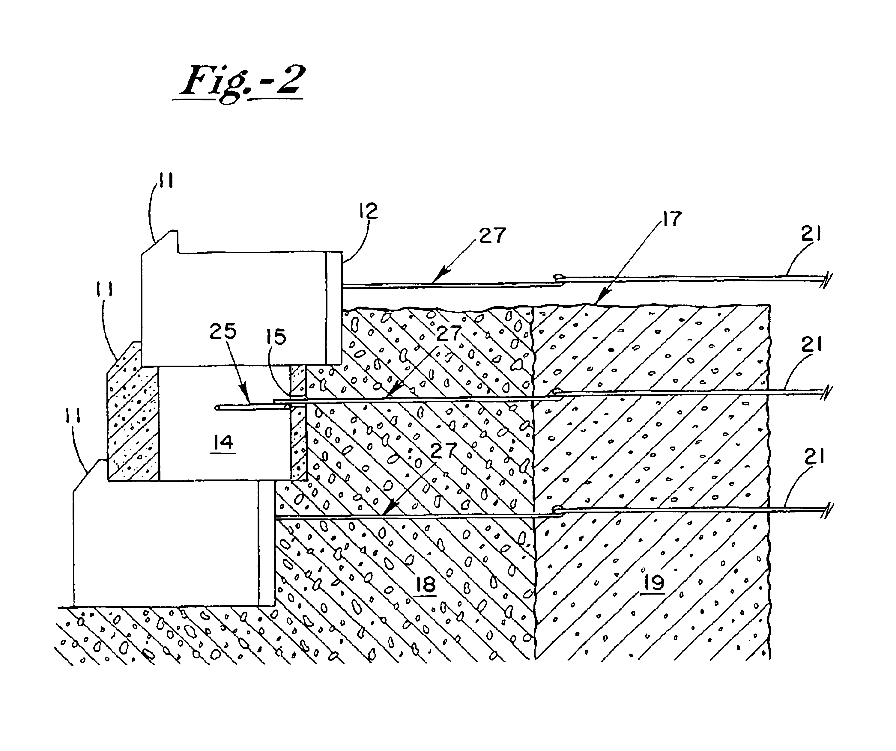 Reinforcing system for stackable retaining wall units