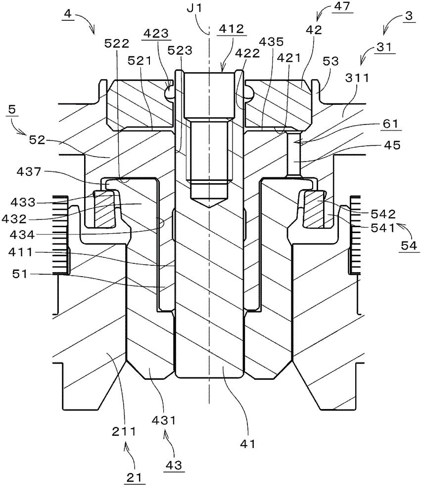 Motor and disk drive device