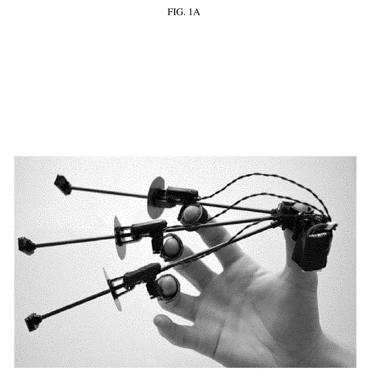 Wolverine: a wearable haptic interface for grasping in virtual reality