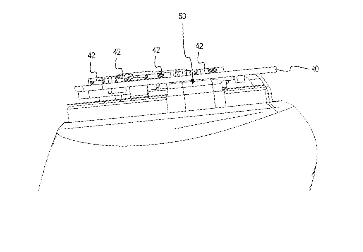 Magnetic induction antenna for use in a wearable device