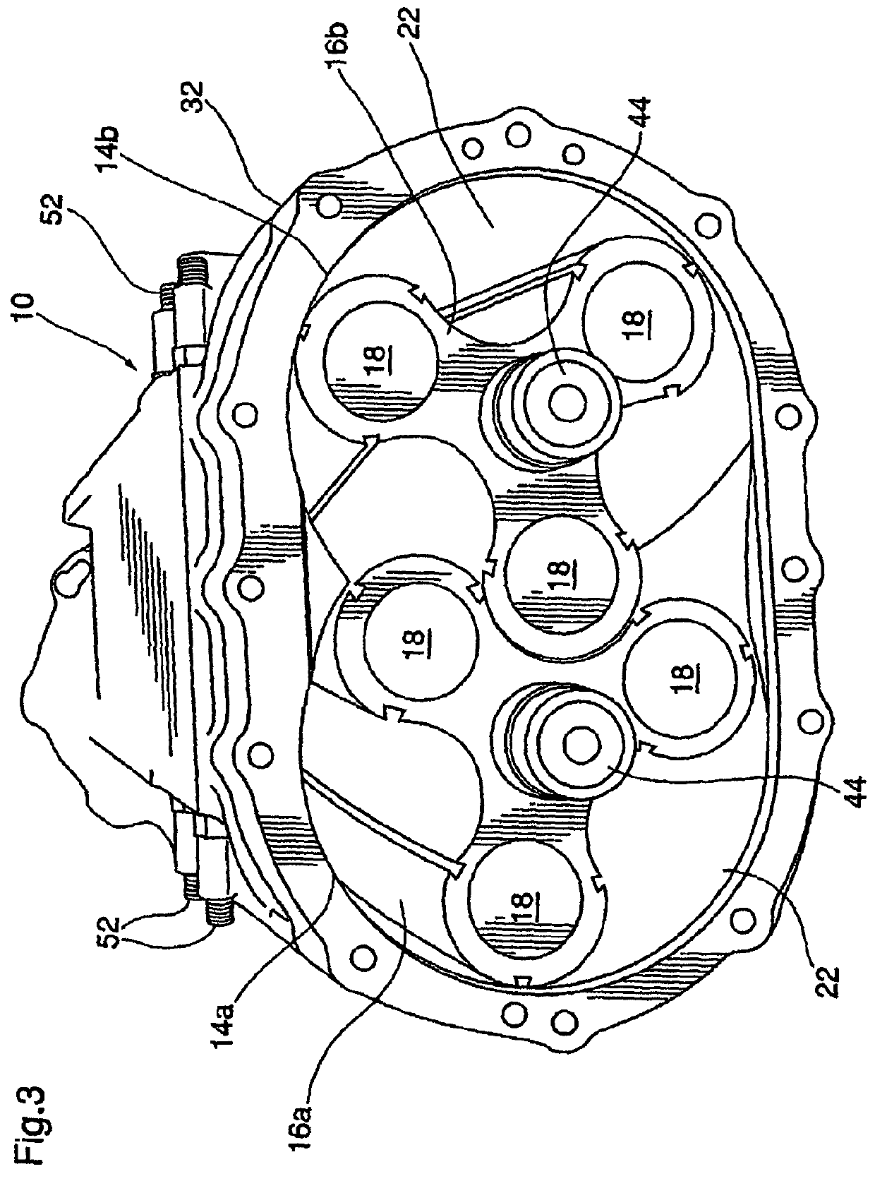 Roots type gear compressor with helical lobes having communication with discharge port
