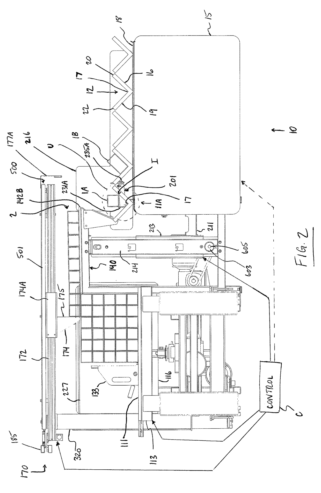 System for loading elongated members such as tubes onto a conveyor for later processing
