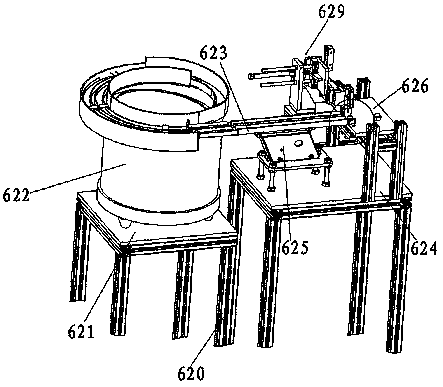 Nut discharge device of solenoid valve partial assembly machine