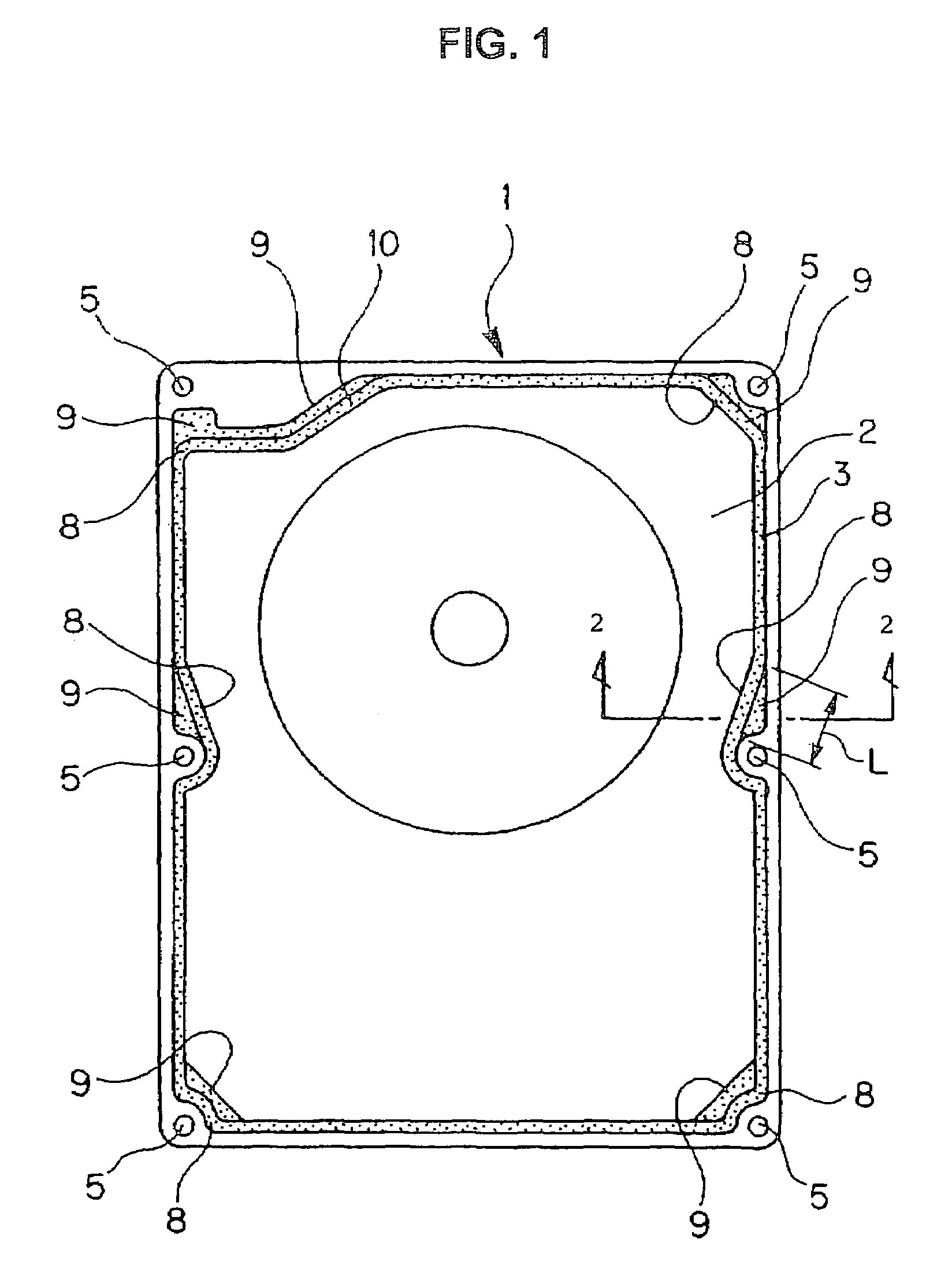Gasket for hard disc drive having compressible lip and extension portion at screw fixing/inflection portions