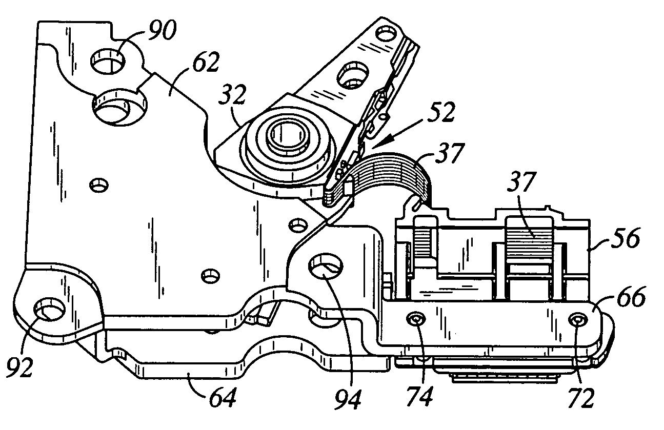 Disk drive having a VCM plate which includes an integrally formed elongated protrusion for securing a flex bracket to the disk drive base