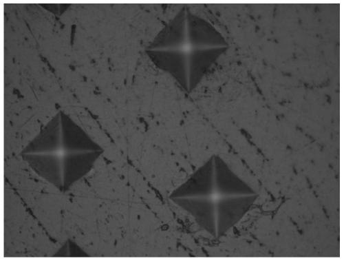 Laser surface zirconium infiltration method for improving surface hardness and wear resistance of titanium alloy