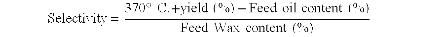 Wax isomerate yield enhancement by oxygenate pretreatment of catalyst