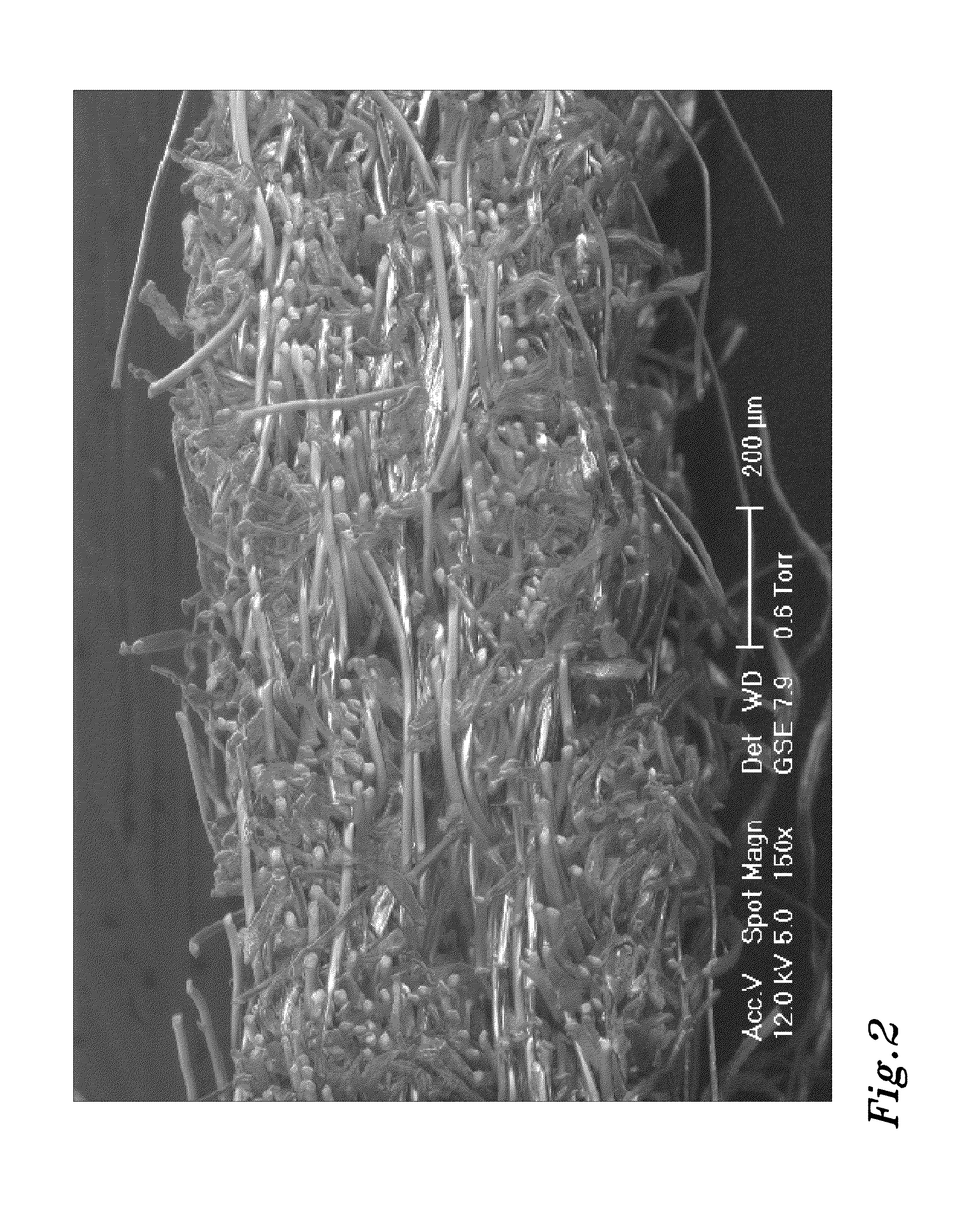 Method of producing a hydroentangled nonwoven material