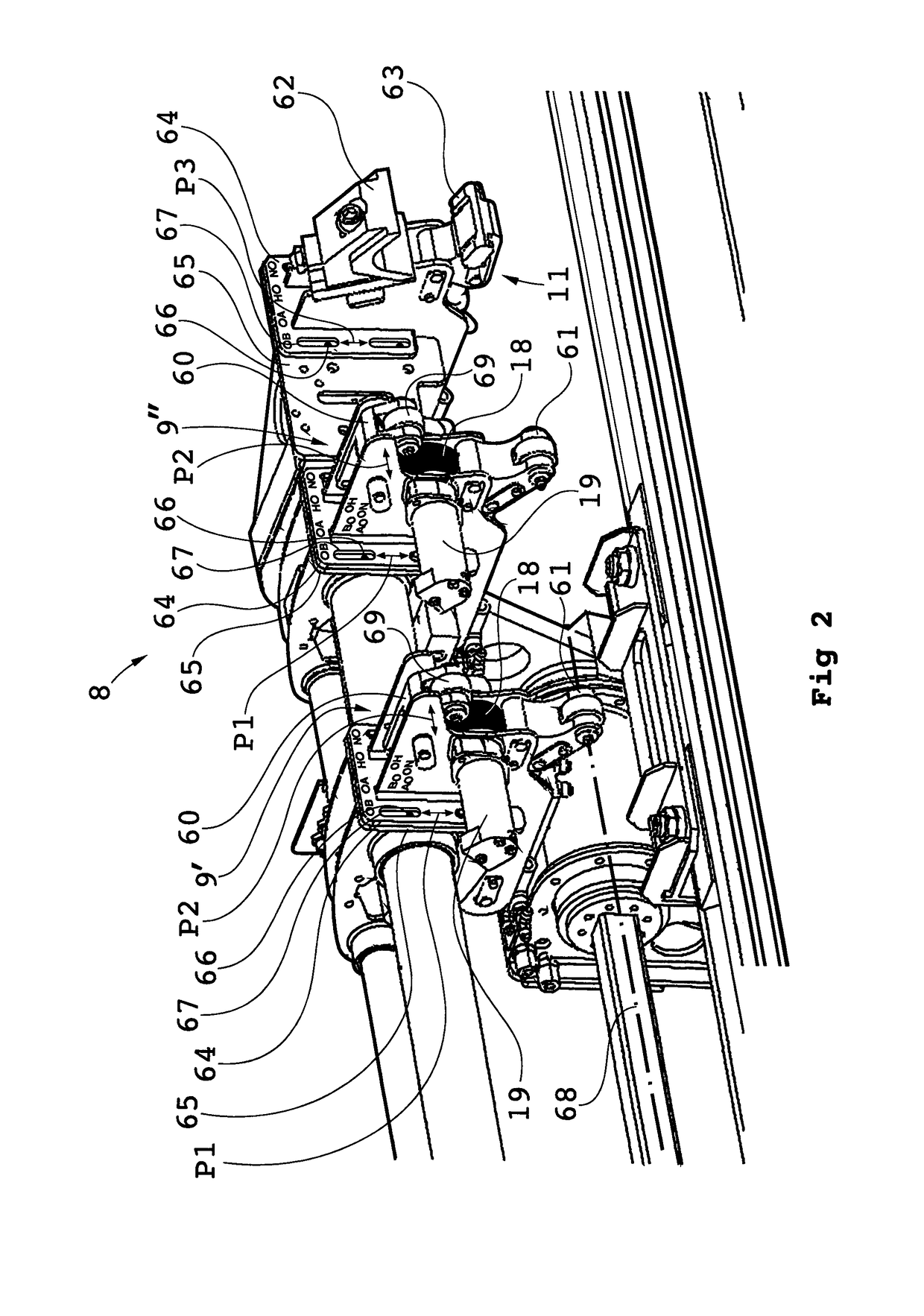 Device for handling drill string components with respect to a rock drill rig and a rock drill rig