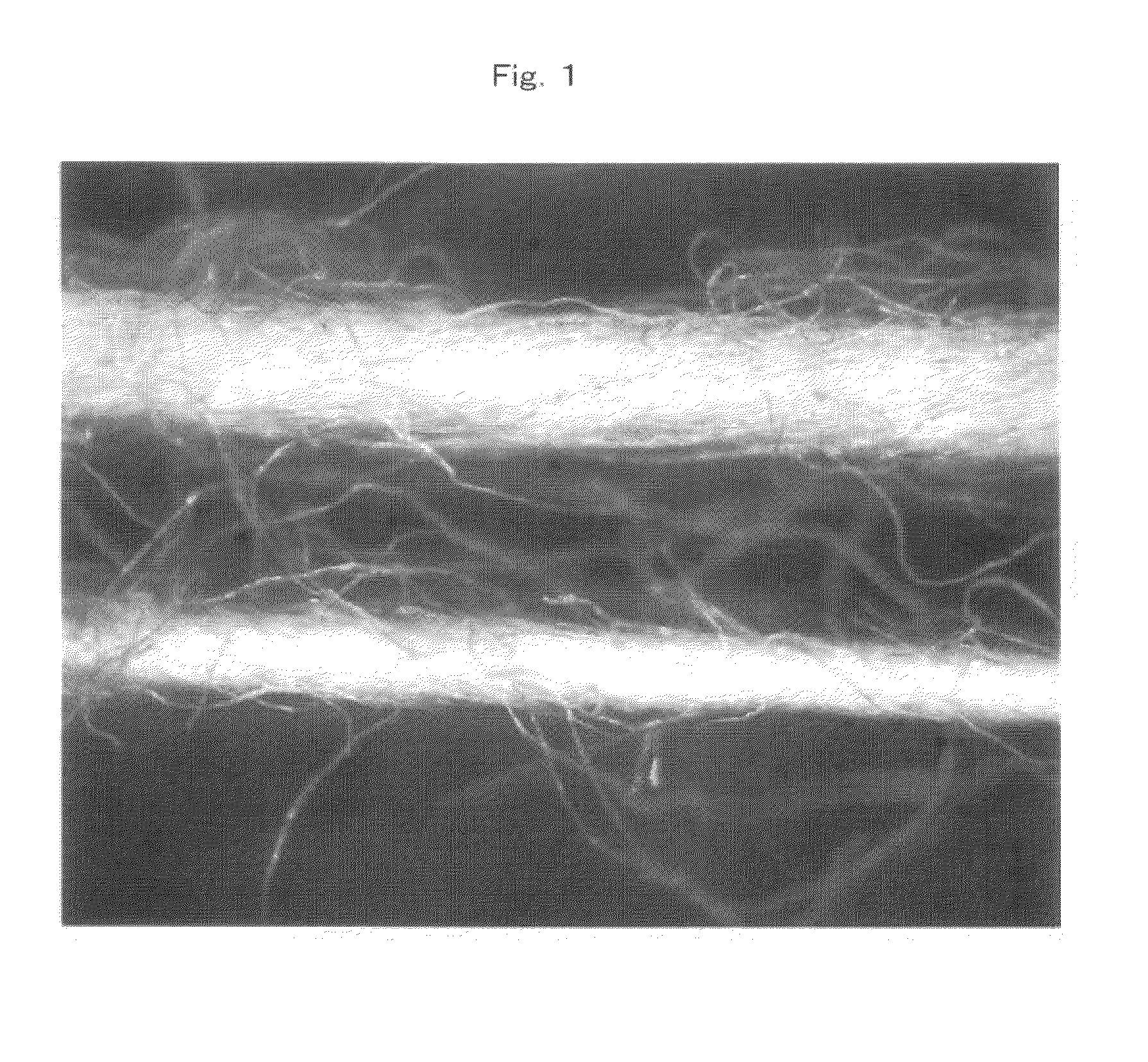 Bulked yarn and wound yarn for production of woven or knit fabric, woven or knit fabric, and method for producing the same