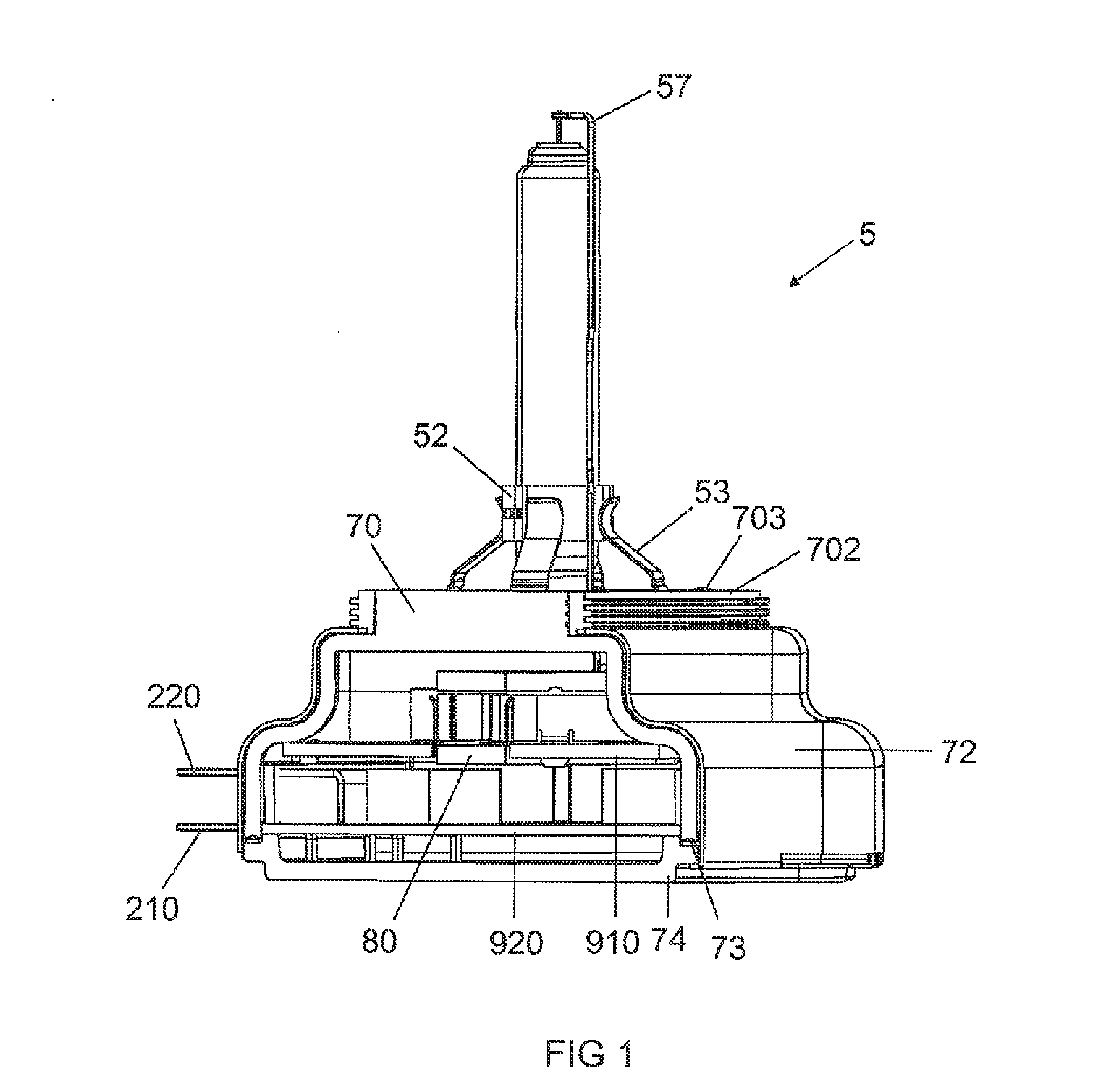 Integrated Gas Discharge Lamp with an Ignition Electronics Integrated Into the Base for Generating Asymmetrical Ignition Pulses